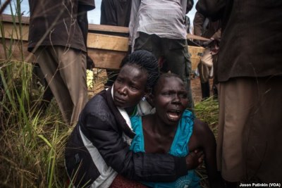 The sister of Duku Evans wails after he was killed (file photo).